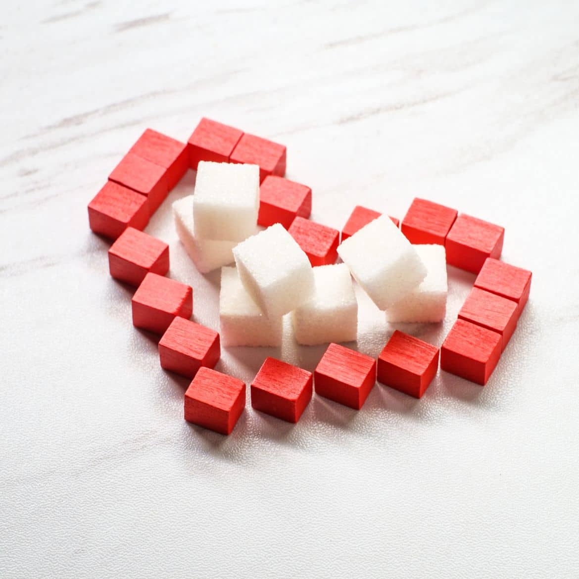 A sugar cubes in a shape of heart representing elements of glucose.